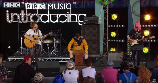 The Happy Endings on stage playing the BBC Introducing stage at Glastonbury earlier this year.