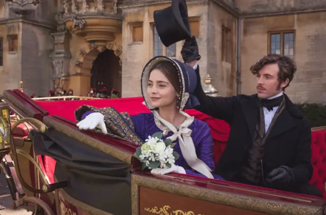 Jenna Coleman and Tom Hughes inside a regal carriage outside Harlaxton manor