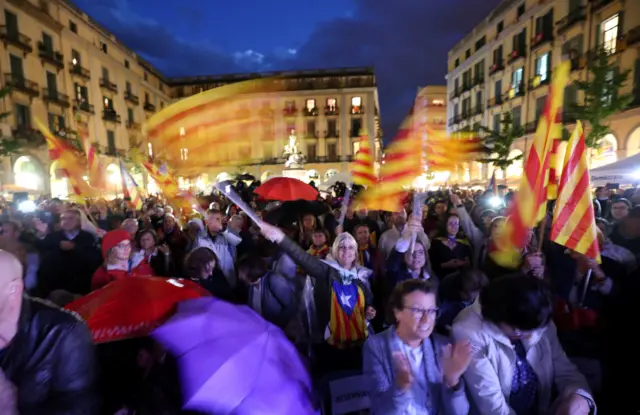 Catalan pro-independence supporters attend a meeting for the referendum in Girona