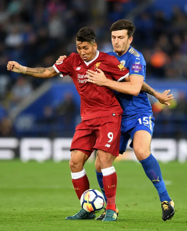 Harry Maguire challenges Roberto Firmino