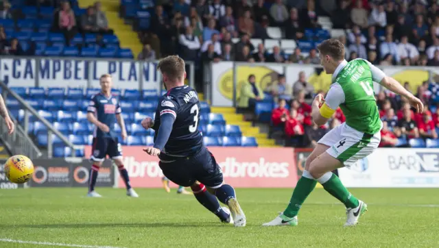 Paul Hanlon (right) scores the only goal of the game so far