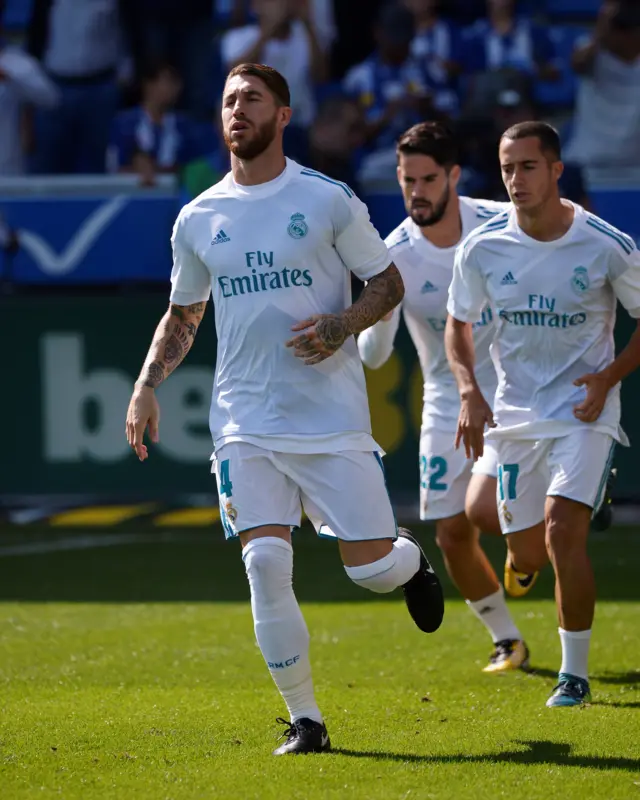 Sergio Ramos, Isco and Lucas Vazquez look on