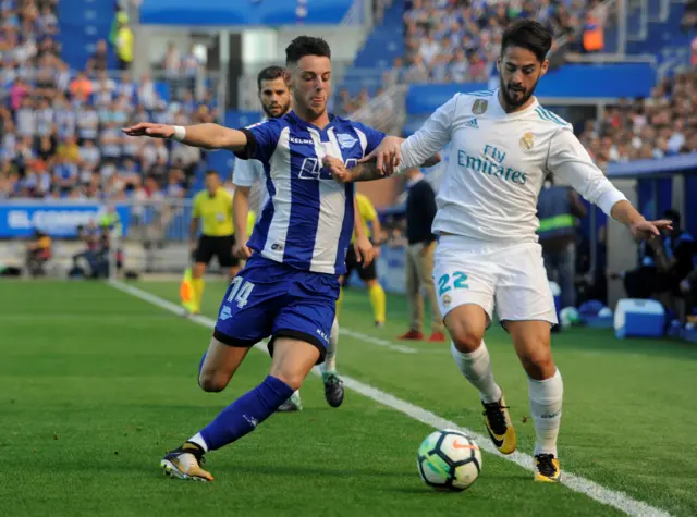 Isco holds the ball