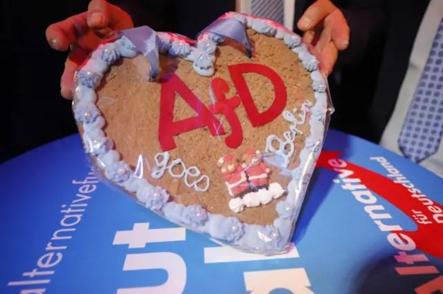 An iced gingerbread heart reading "AfD goes Berlin" is displayed at the AfD HQ