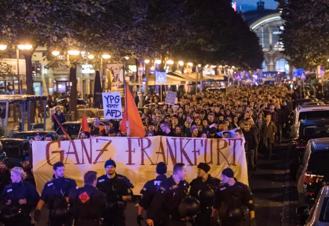 Police patrol in front of a rally against the Alternative for Germany (AfD) party in Frankfurt