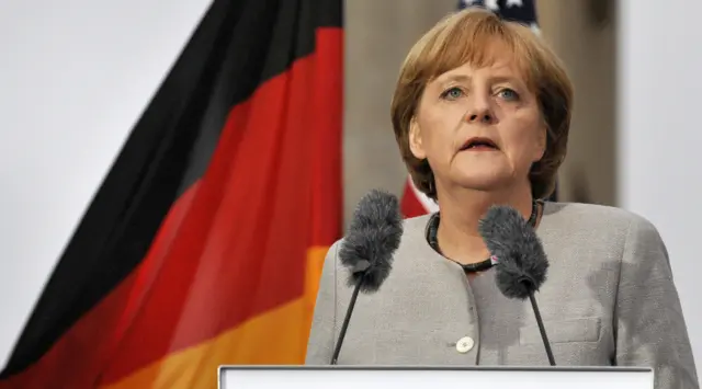 Angela Merkel addresses guests during a ceremony to inaugurate the new US embassy building in Berlin on July 4, 2008