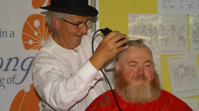 David Harding-Pirce gets his head shaved