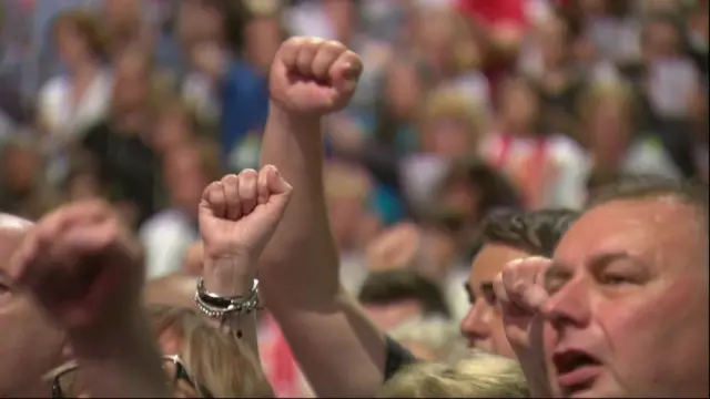 Delegates singing the traditional end of conference song