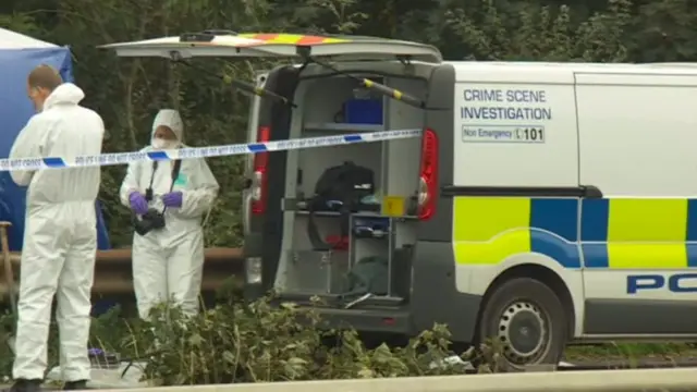 Forensic officers at the scene of a crime