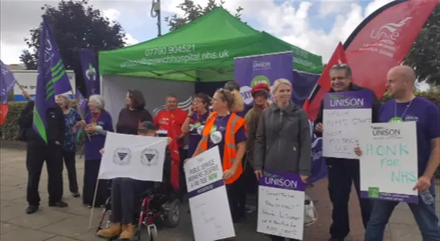 Protestors with banners outside the hospital