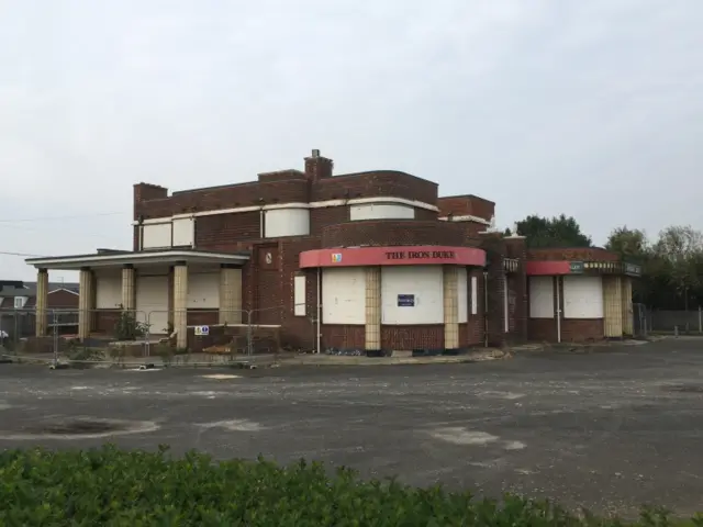 The boarded-up Iron Duke pub