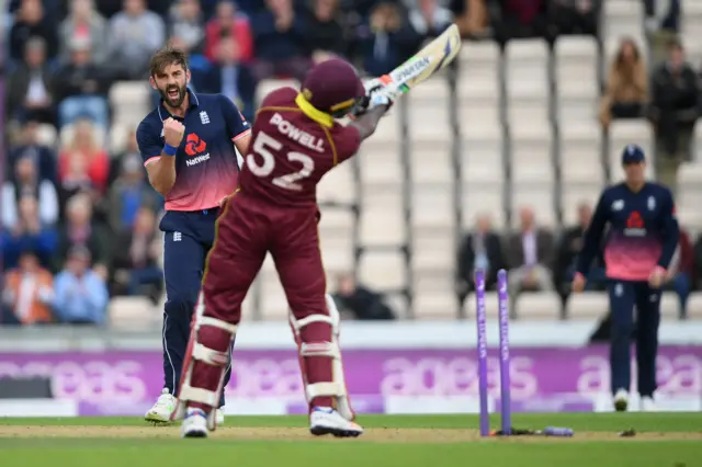 Liam Plunkett of England celebrates after bowling Rovman Powell