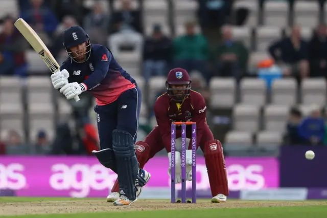 Jonny Bairstow of England plays to the onside as West Indies wicketkeeper Shai Hope looks on during the 5th Royal London One Day International match between England and West Indies at the Ageas Bowl