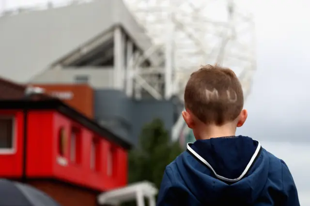 Boy with Manchester United haircut