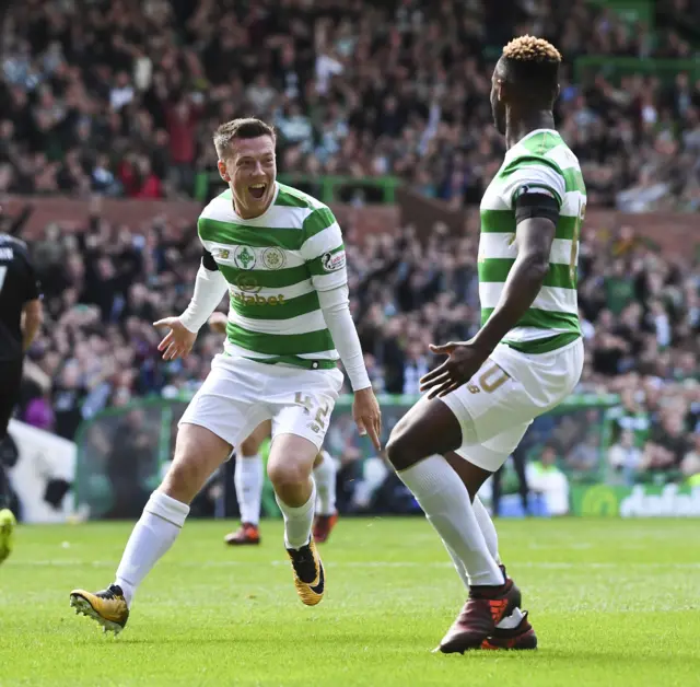 Celtic scorer Callum McGregor celebrates with Moussa Dembele