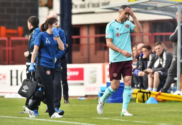 Aaron Hughes goes off injured