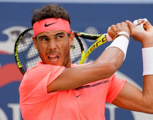 Rafael Nadal of Spain hits to Alexandr Dolgopolov