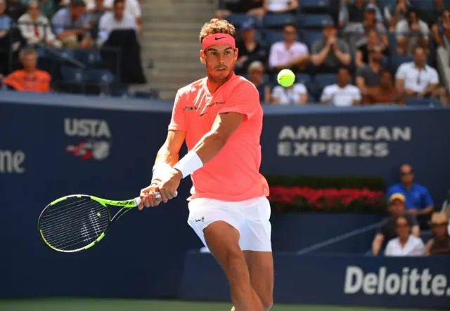 Rafael Nadal of Spain returns with a backhand