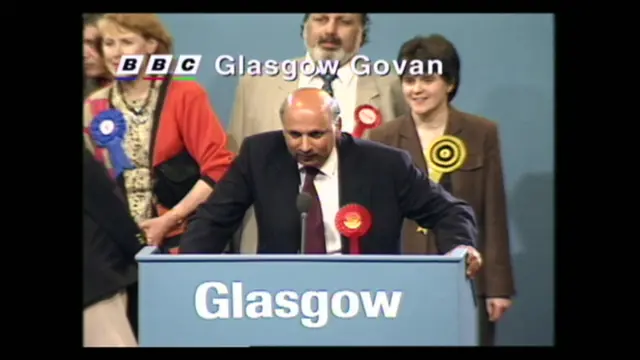 The future first minister in the background as Mohammad Sarwar holds Glasgow Govan for Labour