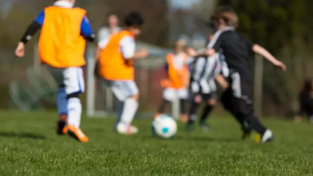 Kids playing football