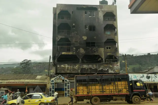 This photo taken on June 16, 2017 in Bamenda shows a hotel destroyed by a fire, allegedly attributed to a radical separatist movement demanding the independance of the anglophone region from the rest of francophone Cameroon.