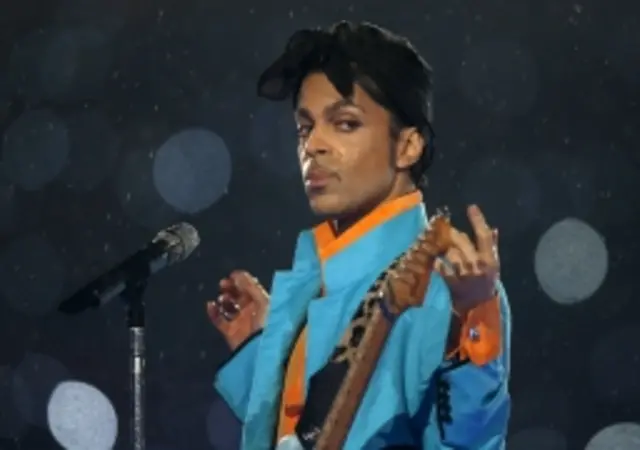 Prince performs during the halftime show of Super Bowl XLI in Miami, Florida, in February 2007.