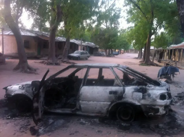 A picture taken on May 7, 2013 of a vehicle burnt by the Islamist group Boko Haram in the northeastern town of Bama. Nigerian gunmen on May 7, 2013 l