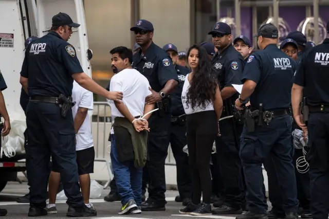 Immigration activists protesting against the Trump administration's Daca decision are arrested outside Trump Tower in New York.