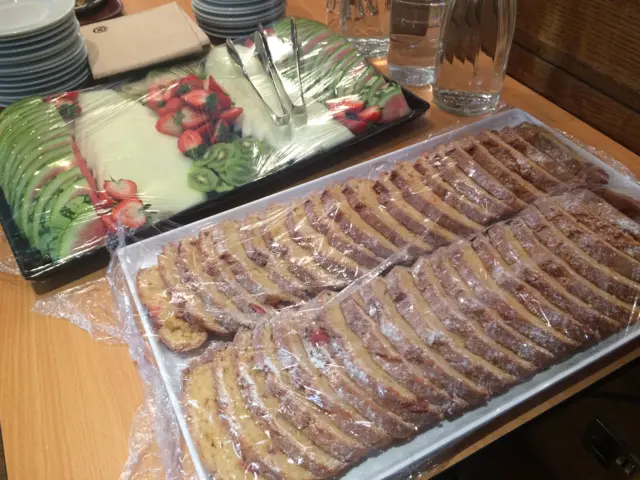 A table filled with bread and fruit