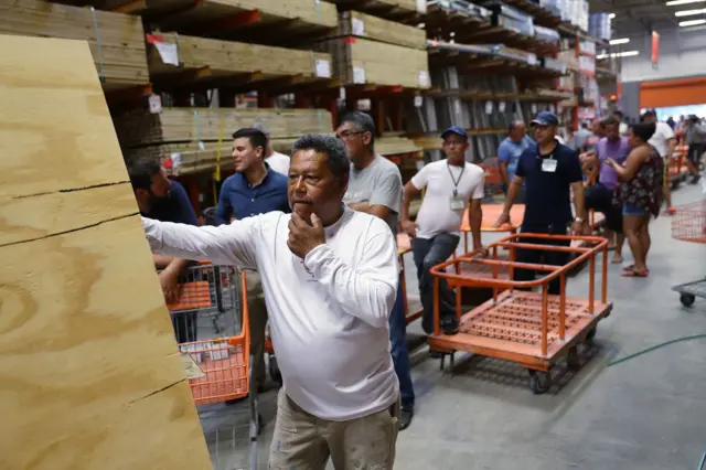 Residents have been buying wooden planks to board up their windows