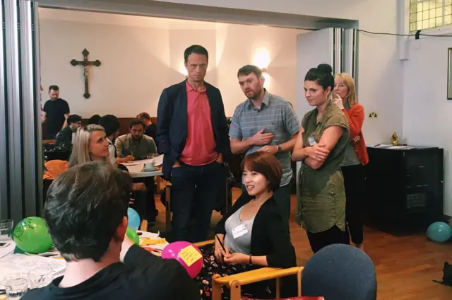 People talking in a room