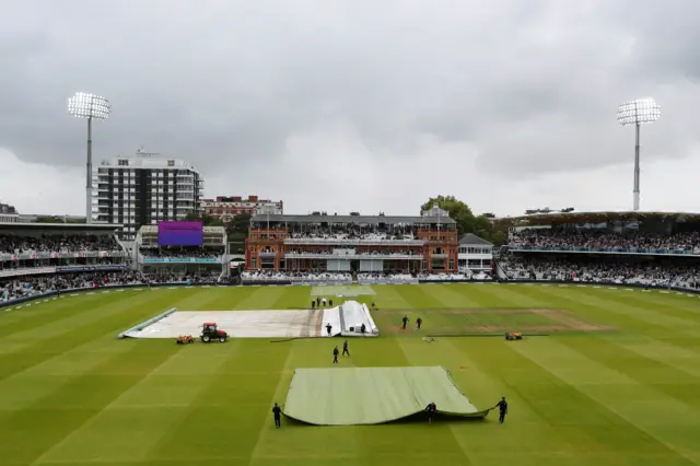 Rain covers coming off at Lords