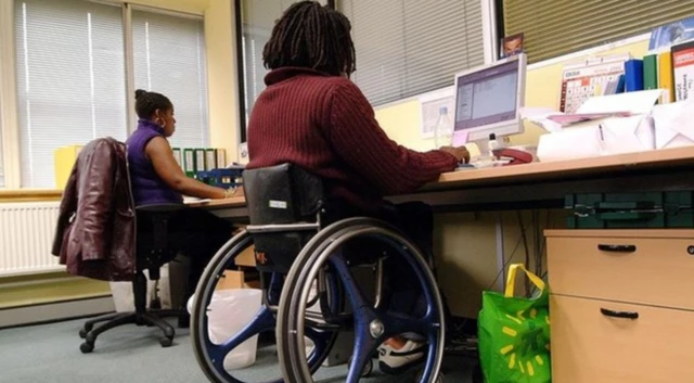 Wheelchair user at work