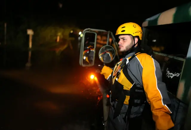 Image shows a member of a rescue team from the local emergency management agency in Puerto Rico