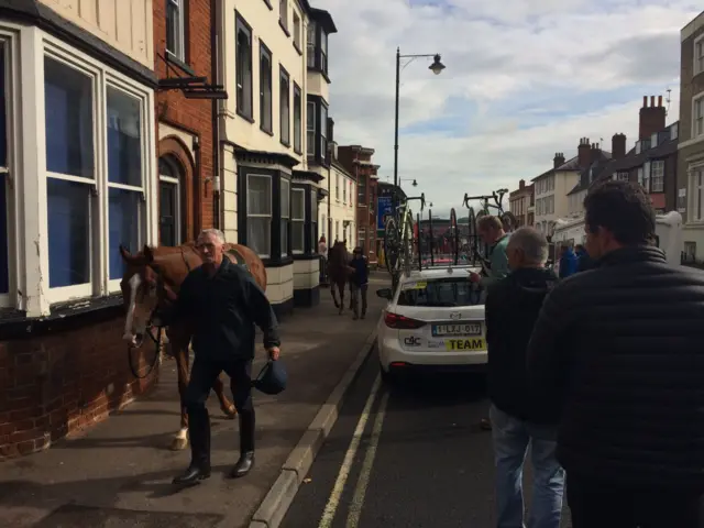 Horse being walked down footpath