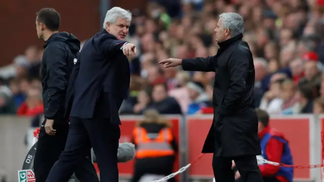 Mark Hughes gestures to Jose Mourinho