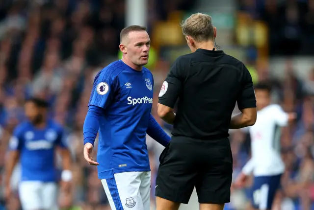 Wayne Rooney of Everton argues with referee Graham Scott