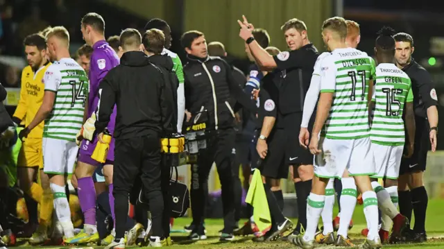 Yeovil players escorted off pitch