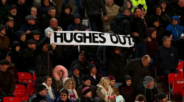 Mark Hughes out banner at Stoke