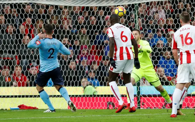 Ciaran Clark skies over