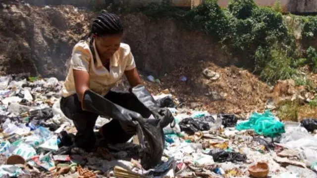 Woman sorting out plastic bags