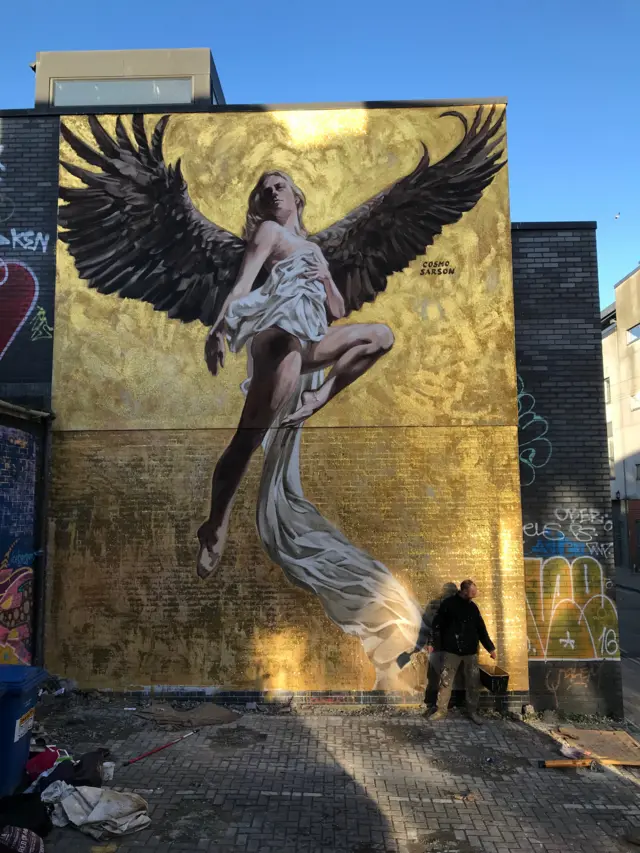 A three-storey high mural on a wall in Brighton