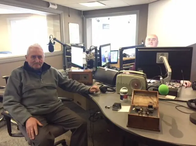 Richard Broadley with his collection of radios talking to Andy Comfort.