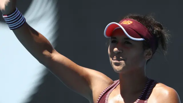 Heather Watson raises her hand to the crowd