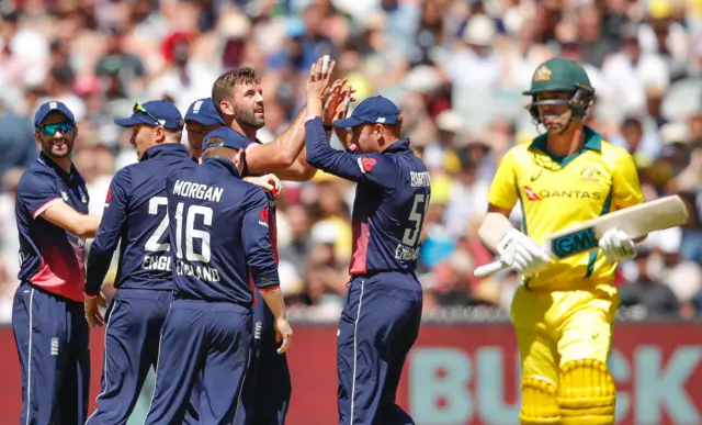 England celebrate the wicket of Travis Head