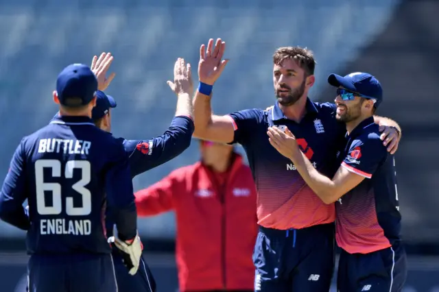 Liam Plunkett celebrates after dismissing Travis Head