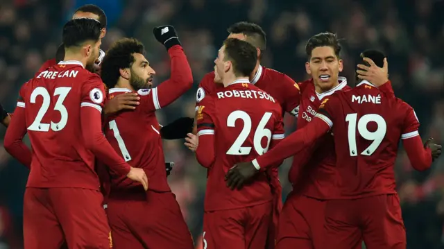 Liverpool players including Roberto Firmino, Sadio Mane and Mo Salah celebrate