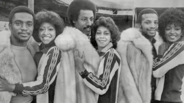 Laurie Cunningham, Brendan Batson and Cyrille Regis with the three degrees