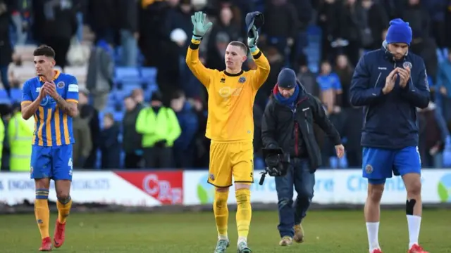 Shrewsbury Town's goalkeeper Dean Henderson (C) gestures after the English FA Cup third round football match between Shrewsbury Town and West Ham United