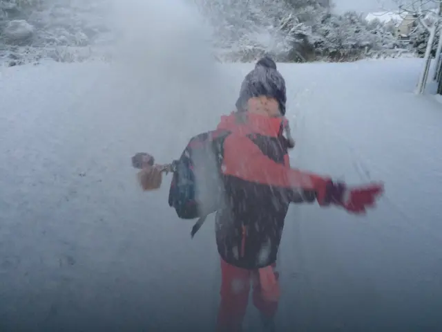 Girl throwing snowball